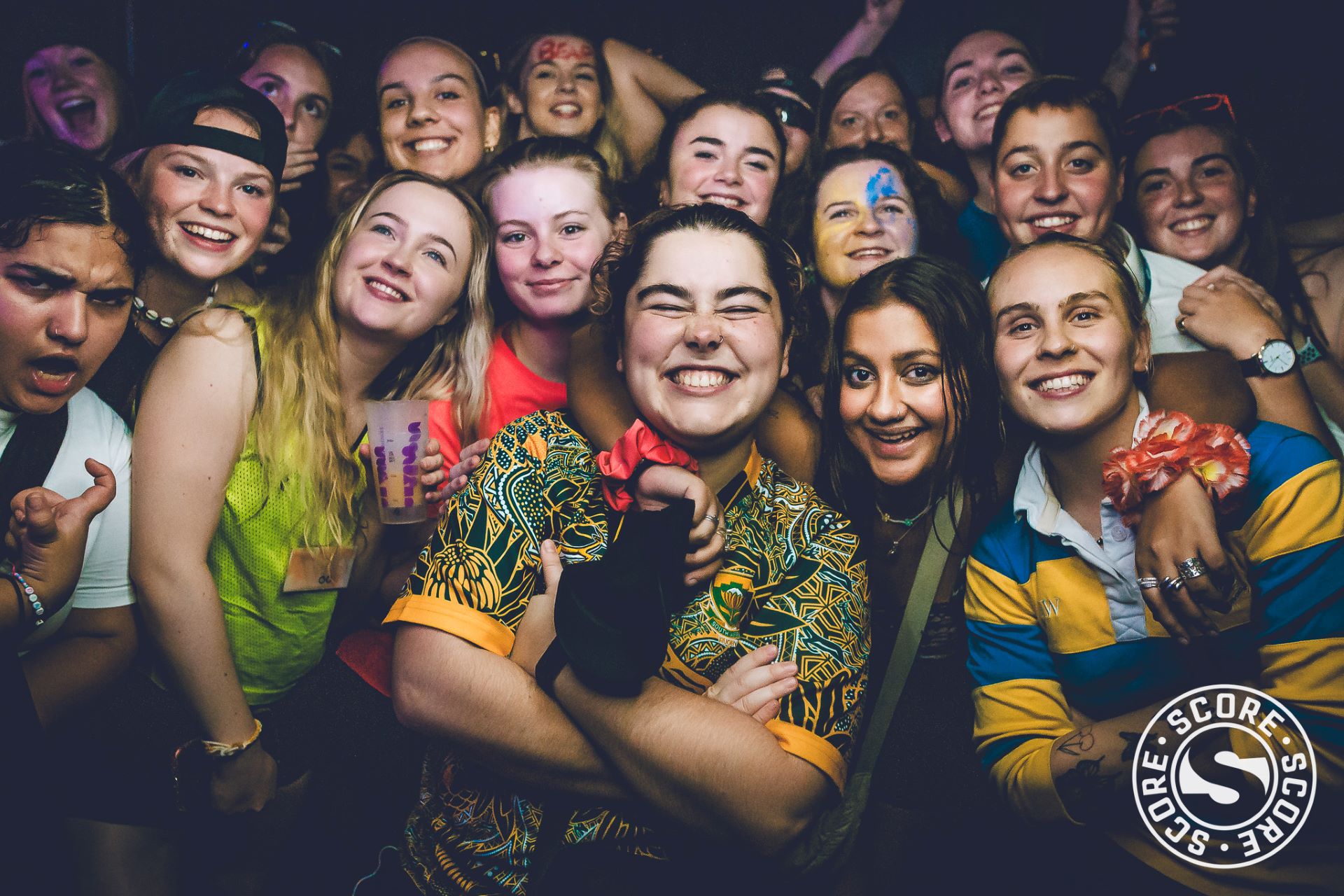 groups of girls at score event smiling for the camera