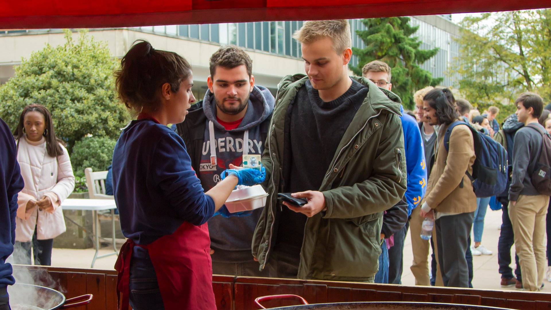 students paying for food at a vender on the bath uni campus