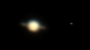 Colour photo of Saturn. The rings and moon Titan can be seen.