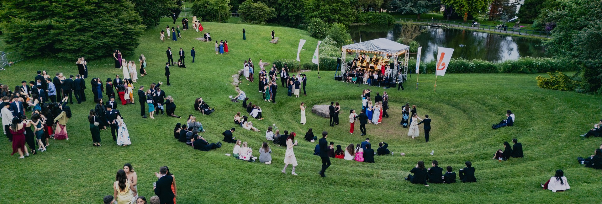 drone shot of students standing on the university green next to the pong